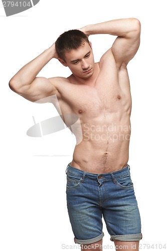 Image of Muscle man posing in studio