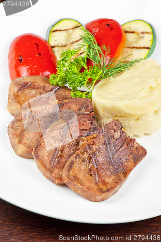 Image of tongue with grilled vegetable