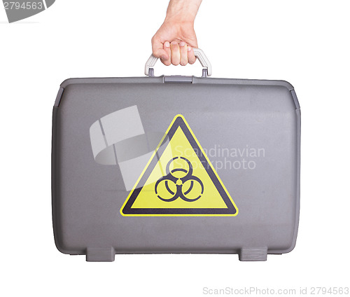 Image of Used plastic suitcase with stains and scratches