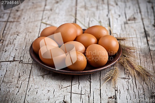 Image of  fresh brown eggs in plate