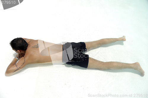 Image of Man relaxing in pool