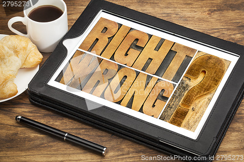 Image of right or wrong dilemma on tablet