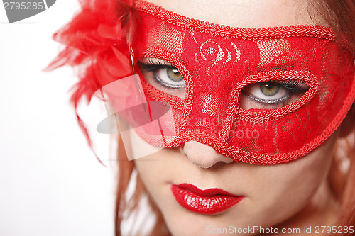 Image of Red head woman wearing mask