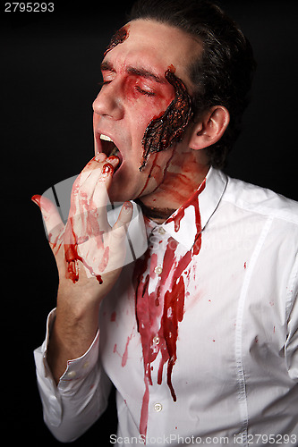 Image of Psychopath with bloody fingers