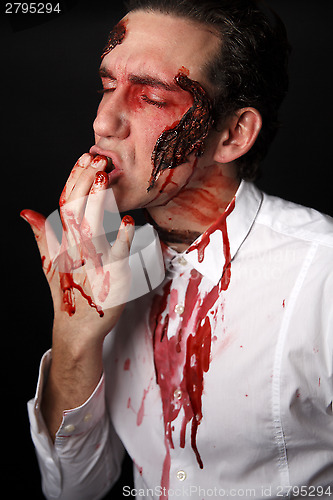 Image of Psychopath with bloody fingers