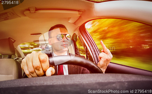 Image of Man driving a car.