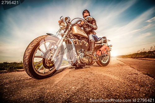 Image of Biker girl on a motorcycle