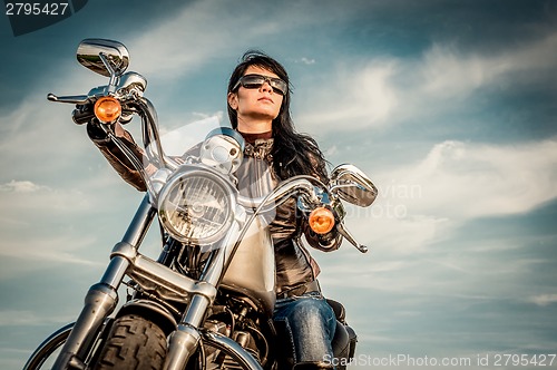 Image of Biker girl on a motorcycle