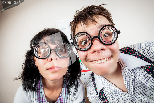 Image of Two person wearing spectacles in an office at the doctor