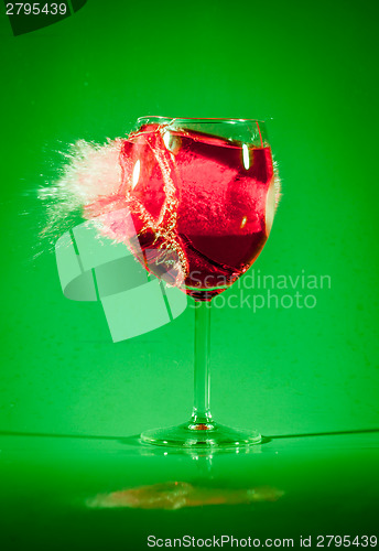 Image of Glass with drink by bullet