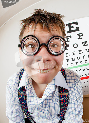 Image of Funny boy wearing spectacles in an office at the doctor