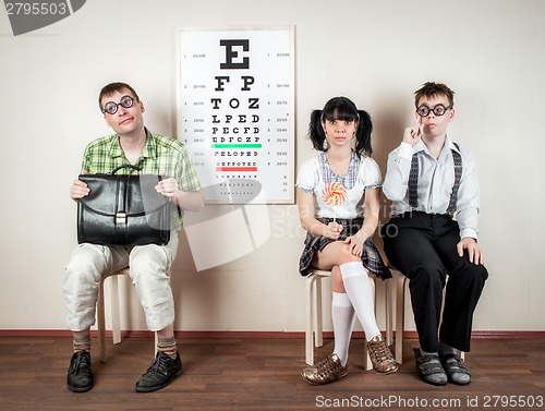 Image of Three person wearing spectacles in an office at the doctor