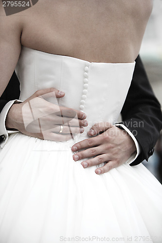 Image of Hands of a bride and groom