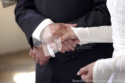 Image of Hands of a bride and groom