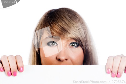 Image of Attractive girl holding blank sheet