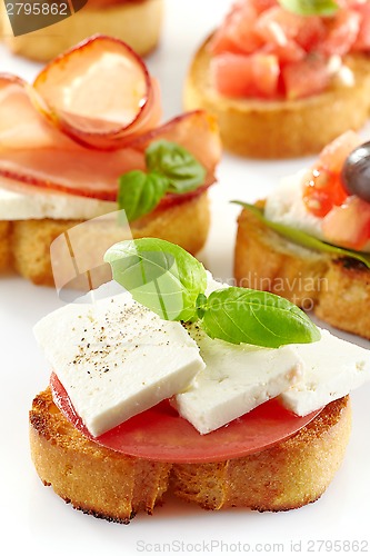Image of Toasted bread with fresh goat cheese and tomato