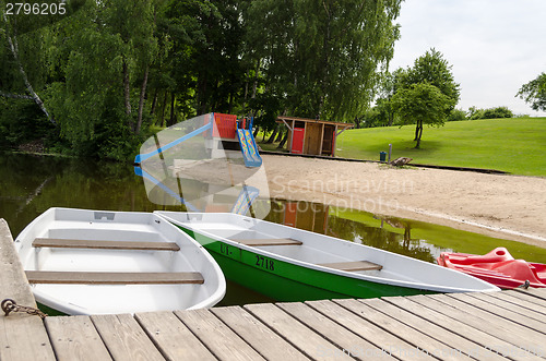 Image of relaxation beach shore and moored boats 