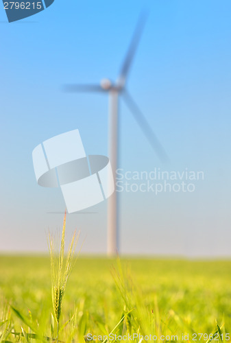 Image of wind turbines on Green wheat field