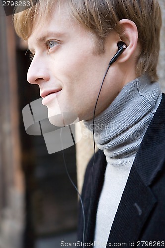 Image of man listens to music