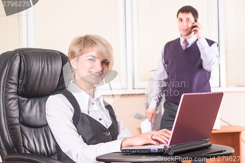 Image of Pretty business lady with laptop