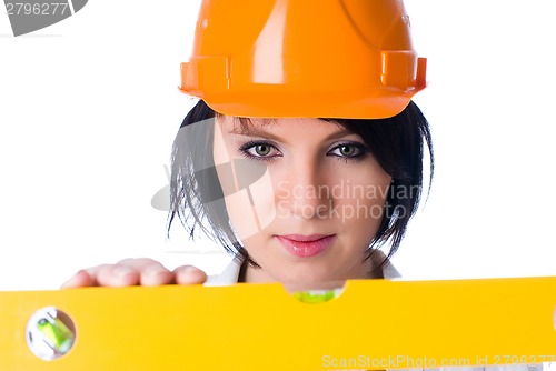 Image of Attractive woman with measuring level