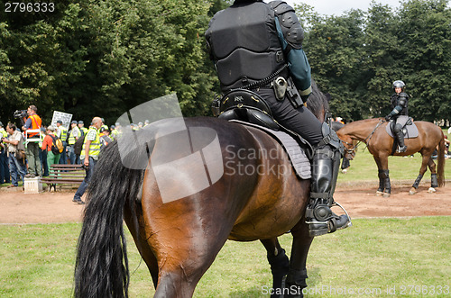 Image of police horse armed armoured policeman in event 