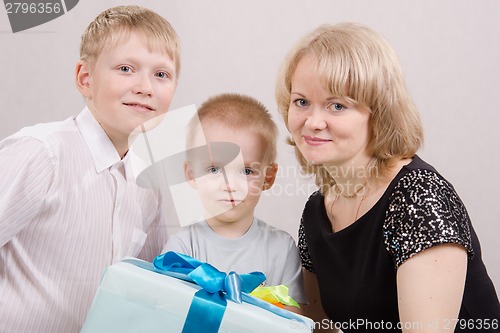 Image of Portrait of a happy family with gifts
