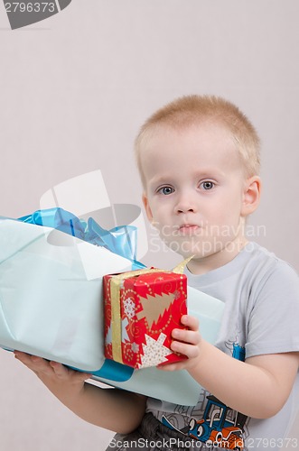 Image of Year-old boy with two gifts
