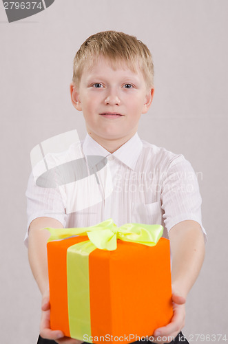 Image of The boy reluctantly giving a gift