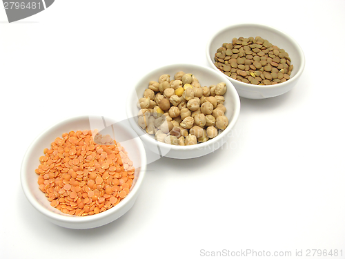 Image of Three bowls of chinaware with garbanzos lentils and red lentils