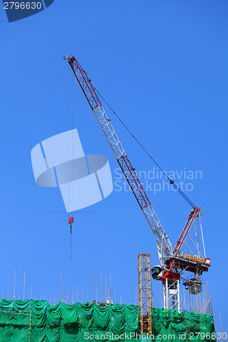 Image of Construction crane on the roof top