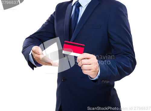 Image of Businessman holding credit card