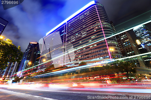 Image of Car light through city at night