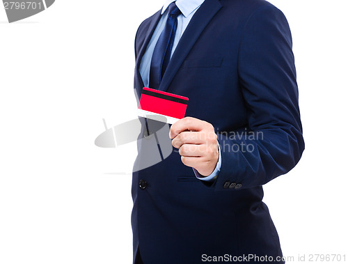 Image of Businessman holding credit card