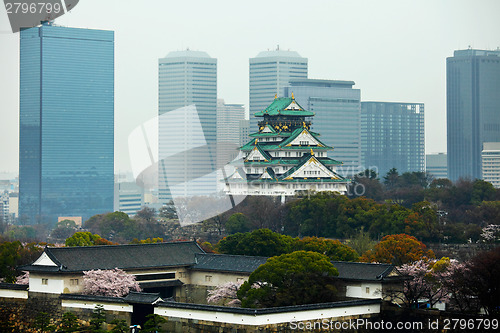 Image of Osaka castle in commercial district in japan