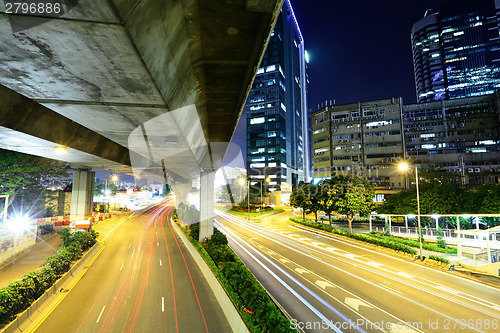 Image of Car light trail and urban landscape