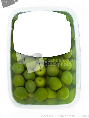 Image of olives in plastic box surface
