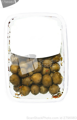 Image of olives in plastic box surface