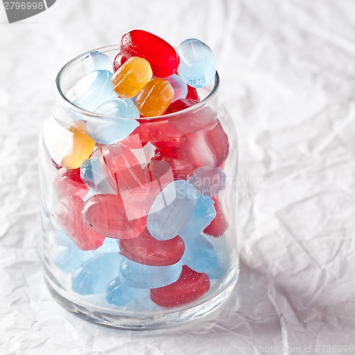 Image of colorful candies in glass jar 