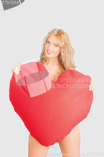 Image of sexy woman holding a heart