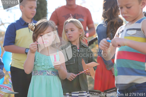Image of Children Enjoying a Fashionable Outdoor Birthday Party