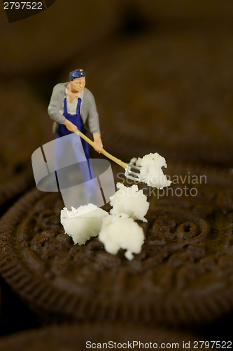 Image of Plastic People Cleaning Up a Messy Cookie