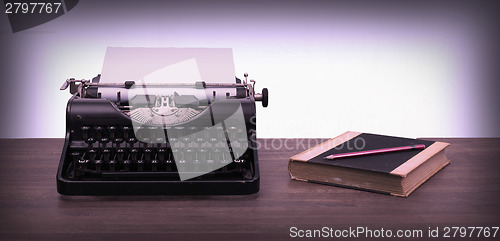 Image of Vintage typewriter and old books