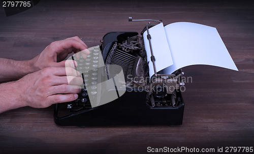 Image of Writer or reporter behind the typewriter