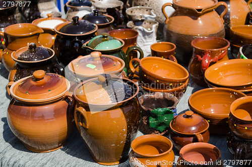 Image of clay pots cups various sizes shapes on fair stall 