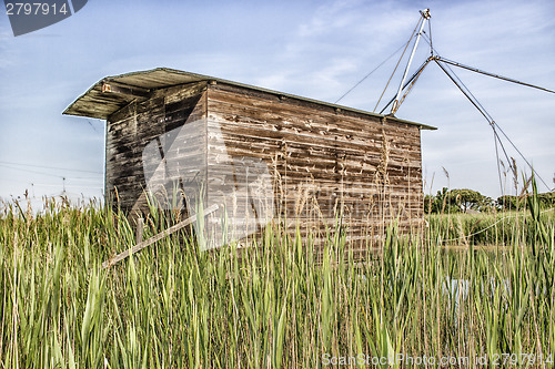 Image of Fishing shack on sea channel