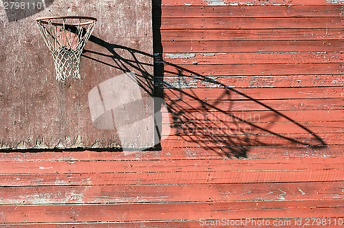 Image of rural basketball backboard and hoop outdoor