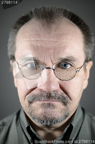 Image of middle-aged man with glasses, mustache and beard 