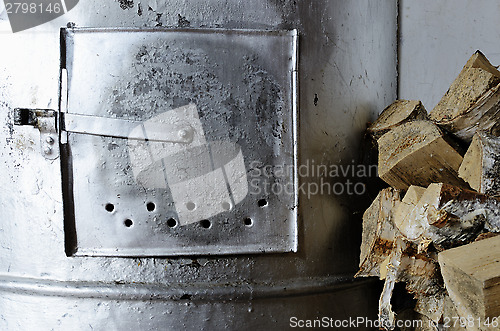 Image of old stove and birch firewood