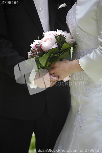 Image of Hands of a bride and groom